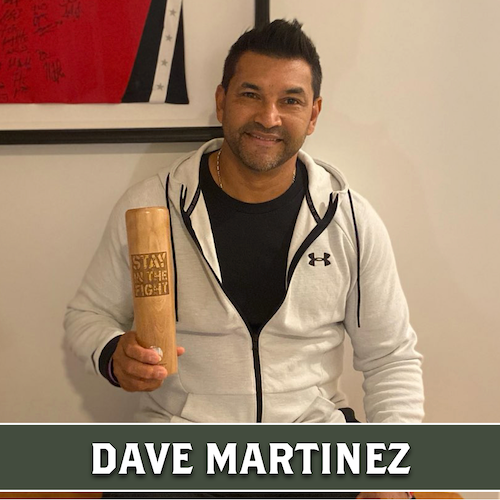 Dave Martinez holding a wooden Dugout Mugs baseball bat mug.
